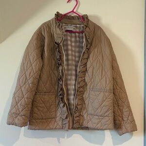 Lightweight quilted ruffle jacket.